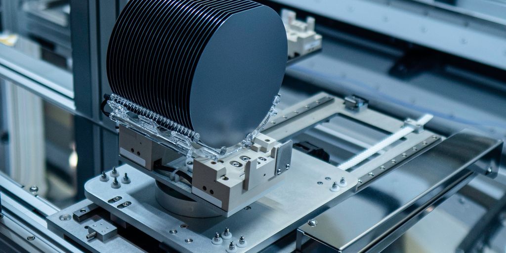 modern semiconductor manufacturing facility with engineers working on wafer production