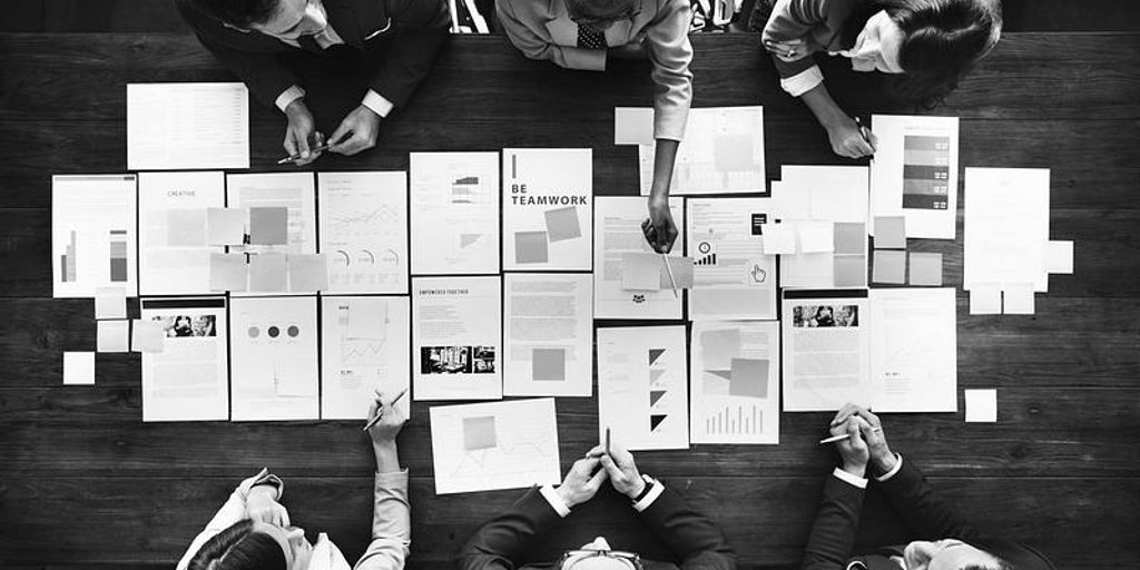 software testing team analyzing data in office environment