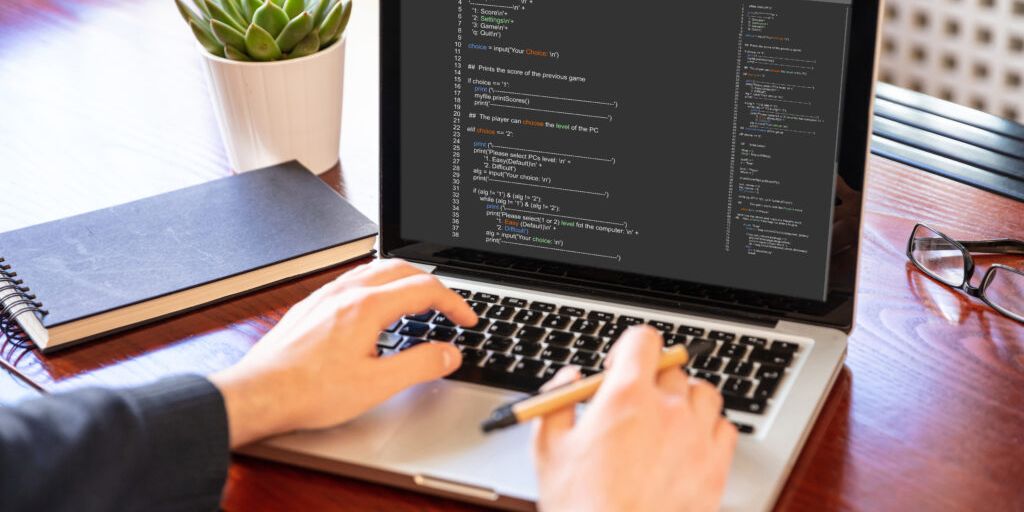 programmer writing unit tests on a computer